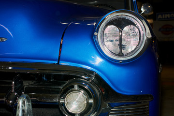 the headlights of an old vintage car