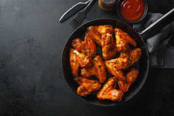 Chicken wings grilled in sauce on pan