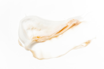 Smeared creme on white background. Dermatology and skincare. Beauty conception.