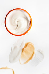 Smeared creme on white background. Dermatology and skincare. Beauty conception.