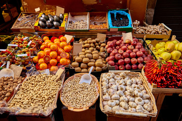 Fototapeta na wymiar big choice of fresh fruits and vegetables on market counter
