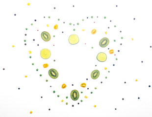 Food flat lay spring summer concept. Heart frame. Vegetables fruit detox white background. Heart frame. Minimal flat lay concept. Vegetarian. Kids fun food. Copy space.