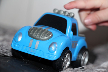 machine,toy,калесо,blue,gray,white,black,hand child,finger