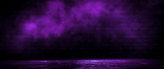 Dark empty room, old brick walls, concrete floor, smoke, pyal, smog. Violet abstract light, night view.