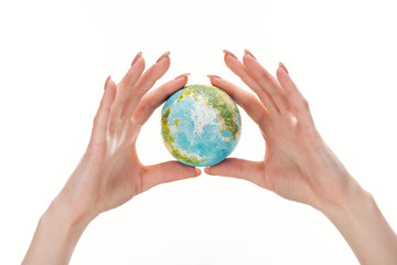 partial view of woman holding earth model isolated on white, global warming concept