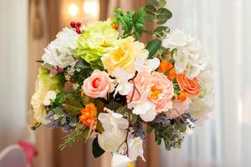 beautiful bouquet of colorful flowers at the wedding table