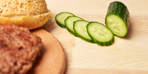 slices of cucumber on wooden board