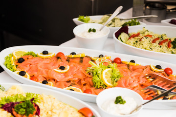 dishes with various salads in buffet restaurant