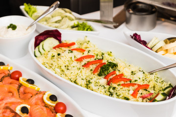 dishes with various salads in buffet restaurant