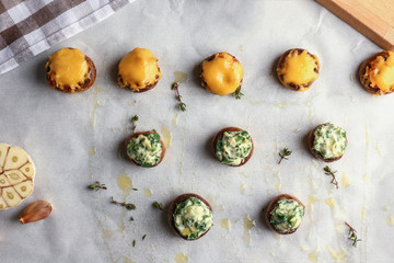 Tasty stuffed mushrooms on parchment