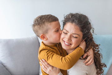 Son is kissing his mother