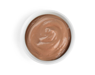 Bowl with chocolate yogurt on white background