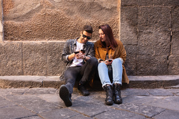 young couple sitting on a bench