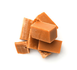 Tasty sweet caramel on white background
