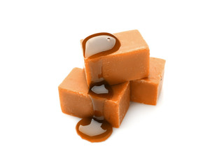 Tasty sweet caramel on white background