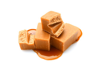 Tasty sweet caramel on white background
