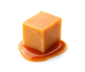 Tasty caramel candy on white background