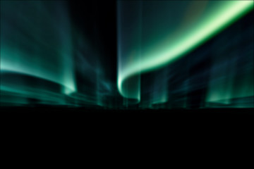 green northern lights against black back ground.