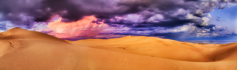 Fototapeta na wymiar Dunes Stormy Clouds Pink Pan