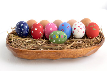 Fototapeta na wymiar colorful easter eggs in a basket