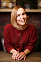 Portrait of smiling woman with wine glass