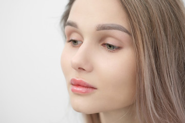 Obraz premium Close-up of the face of a beautiful young blonde girl with smooth skin.