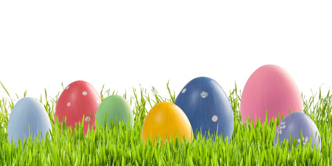 Easter eggs in green grass isolated
