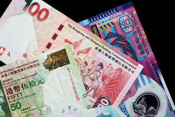 Hong Kong dollars bills on a dark background close up