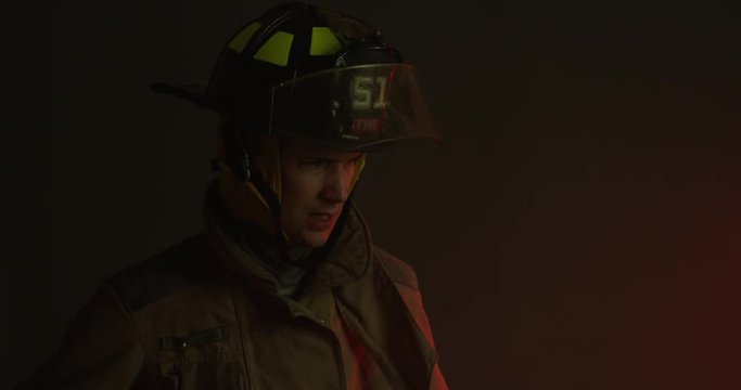 Firefighter searching on ground - medium shot - slow motion