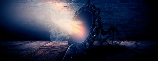 Mirror magic, fortune telling and fulfillment of desires. Fantasy with a mirror, dark room, magical...