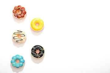 Set of colorful donuts isolated on white background.