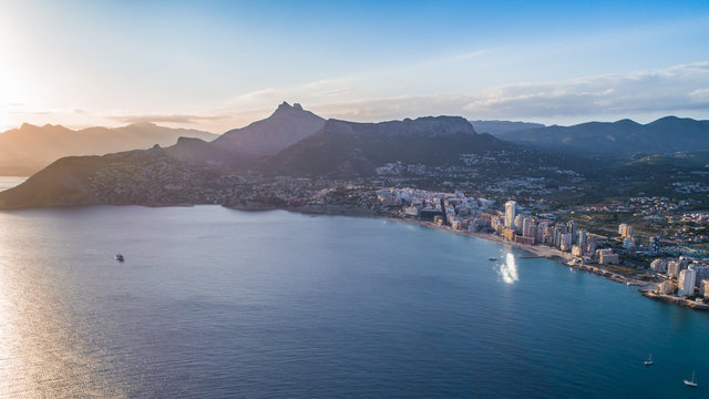 Aerial photo of costal town with view point from the Peñon de Ifach. Prety summer sunset. Calpe, Alicante province, Costa Blanca, Spain