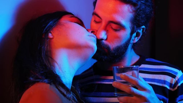 attractive Young couple kissing,flirting in the dark.Flirt,eros,attraction