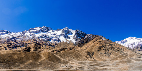 Snow-covered peaks and blue sky