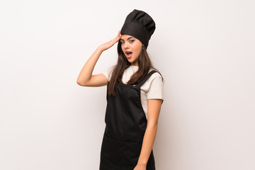 Naklejka premium Teenager chef over white wall has just realized something and has intending the solution