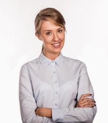 Successful business woman with arms crossed - isolated over white