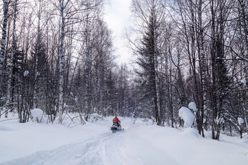 Athlete on a snowmobile.