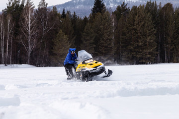 Athlete on a snowmobile.