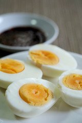 Hard boiled eggs in white dish served in restaurant with space for write wording, delicious high nutrition food that good for muscle, eye, bone and healthy growth for kids, patients and everyone