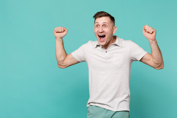 Portrait of excited young man in casual clothes expressive gesticulating with hands isolated on...