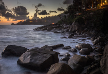 Sunset on coast of sea