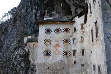 The beautiful medieval Predjama castle built inside the rocky mountain in Slovenia. Famous tourist attraction in Europe