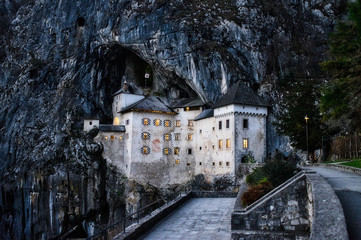 The beautiful medieval Predjama castle built inside the rocky mountain in Slovenia. Famous tourist...