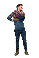Fototapeta premium Full-length shot of Hippie man suffering from backache for having made an effort on isolated white background