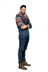 Fototapeta premium Full-length shot of Hippie man with arms crossed and looking forward on isolated white background