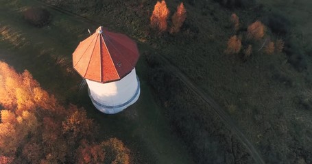 Historical water power station in natural landscape. Autumn, seasonal scenic view. Village in Poland.