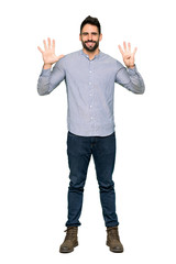 Full-length shot of Elegant man with shirt counting nine with fingers on isolated white background