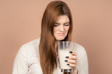 girl drinks milk and is happy