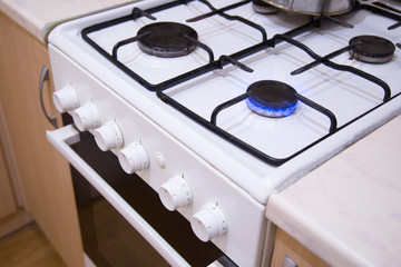 blue flames of gas stove