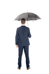 rear view of businessman standing with umbrella isolated on white